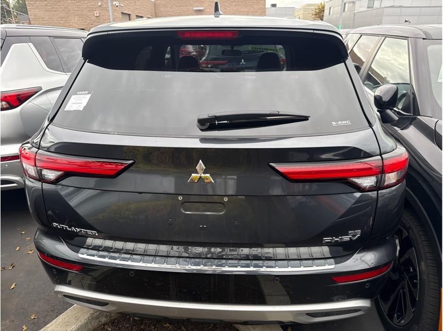 2025 Mitsubishi Outlander PHEV — rear three-quarter view