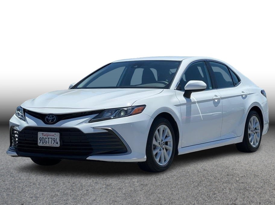 2023 Toyota Camry LE Sedan 4D in White — front three-quarter view
